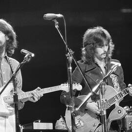 George Harrison And Eric Clapton by Bettmann