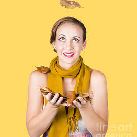 Girl catching autumn leaves by Jorgo Photography