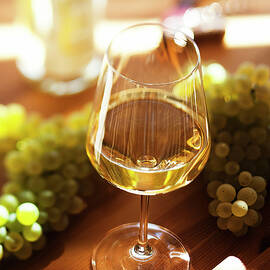 Grapes And Glass Of Wine by Franco Cogoli