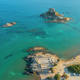 Greece, Dodecanese, Kos Island, Greek Islands, Kefalos Bay, Aerial View Of Ruins Of Basilica Of Agios Stephanos And Kastri Islet With Tiny Church Of Agios Nikolaos by Giorgio Filippini