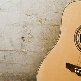 Guitar And Brick Wall by Jupiterimages
