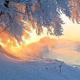 Icy River At Sunset With Frost Smoke by Simon Butterworth