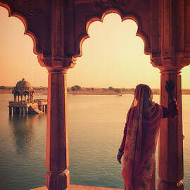 Indian Woman Looking At Landscape by Michele Falzone