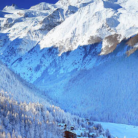 Italy, Aosta Valley, Aosta District, Alps, Val Di Cogne, Cogne, The Village Of Cogne And The Gran Paradiso Group In Background After A Winter Snowfall by Davide Carlo Cenadelli