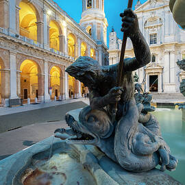 Italy, Marches, Ancona District, Loreto, The Fontana Maggiore, In The Piazza Della Madonna (square) With The Basilica Della Santa Casa In Background At Dusk by Franco Cogoli