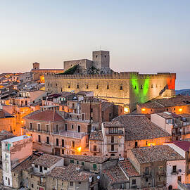 Italy, Sicily, Messina District, Montalbano Elicona, Parco Dei Nebrodi, The Village Of Montalbano Elicona At Dusk With The Castle Palazzo Reale Federico Iii by Antonino Bartuccio