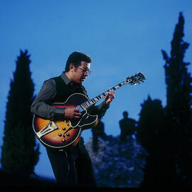 Kenny Burrell Performs On Stage by David Redfern