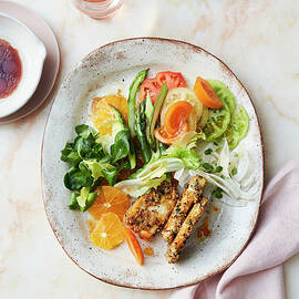 Lamb's Lettuce Salad With Green Asparagus, Tomatoes, Oranges And Halloumi by Thorsten Suedfels / Stockfood Studios
