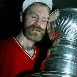 Lanny Mcdonald Hugs The Stanley Cup by B Bennett
