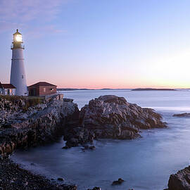 Lighthouse On Rocky Cliff by Franco Cogoli