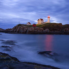 Lighthouse On Rocky Coast by Franco Cogoli