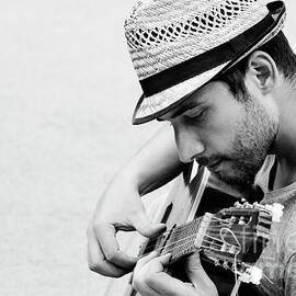 Man plays the guitar by Jelena Jovanovic