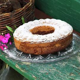 Marble Cake With Icing Sugar On A Rustic Wooden Bench by Christine Gillé
