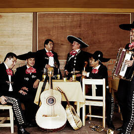 Mariachi Musicians Relaxing Together In by Pixelchrome Inc