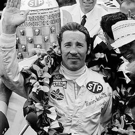 Mario Andretti Bedecked With Flowers by Bettmann