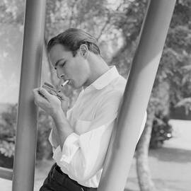 Marlon Brando Lighting A Cigarette by Bettmann