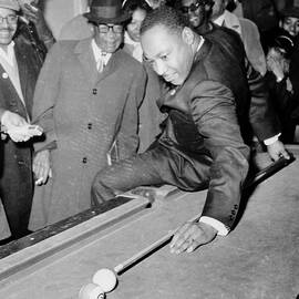 Martin Luther King Playing Pool by Bettmann