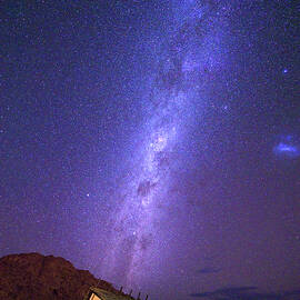 Milky way over a small chalet of a desert lodge near Sossusvlei in Namibia by Miroslav Liska