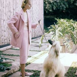 Model With An Afghan Hound by Clifford Coffin