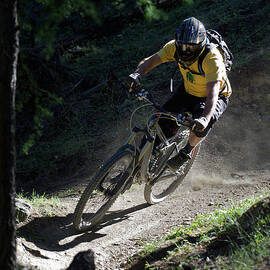 Mountain Biker On Dirt Path by Michael Truelove