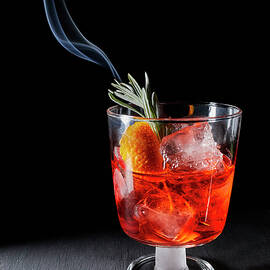 Negroni With A Smoldering Rosemary Sprig by Natasa Dangubic