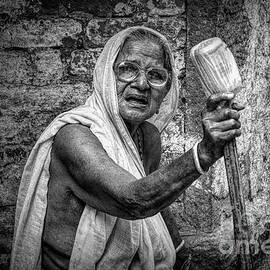indian street photo - old poor woman portrait by Stefano Senise