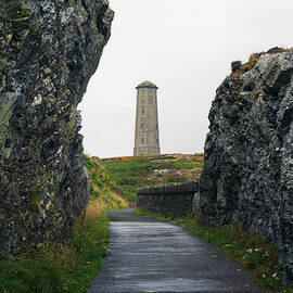 Pathway leading towards Wicklow Head Lighthouse in Ireland by Miroslav Liska