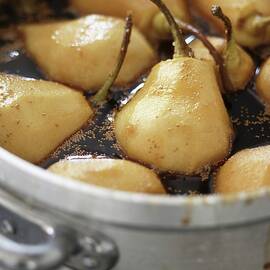 Pears Being Poached In Red Wine by Joerg Lehmann