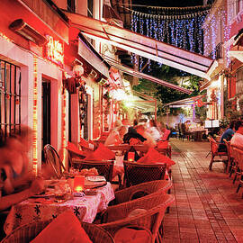 People Dining Outside Restaurants At by Gary Yeowell