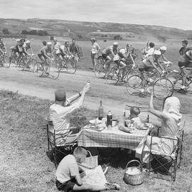 Picnicking Family Greets Tour De France by Bettmann