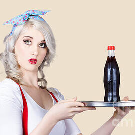 Pinup girl waiter holding silver soda tray by Jorgo Photography