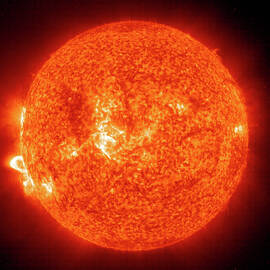 Post-flare Loops Erupt From Suns Surface by Nasa