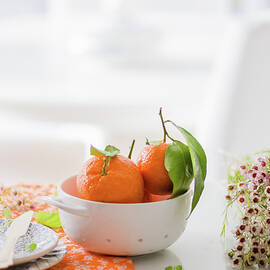 Raw Tangerines With Wax Flowers by Au Petit Gout Photography Llc