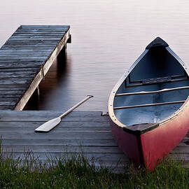 Red Canoe On A Dock by Imaginegolf