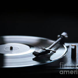 Retro gramophone vinyl player over black background with copyspa by Jelena Jovanovic