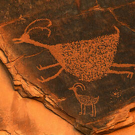 Rock art at Eye Of The Sun Arch by Dan Norris