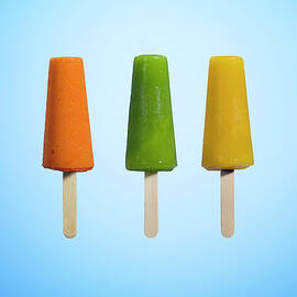Row Of Different Flavors Of Ice Cream by Jonathan Knowles