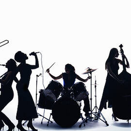 Silhouette Of Female Musicians by Pm Images