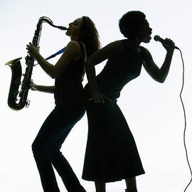 Silhouette Of Female Singer And by Pm Images