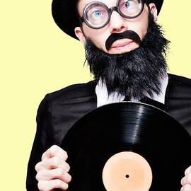 Sixties Retro Rock Man Holding Music Record Vinyl by Jorgo Photography