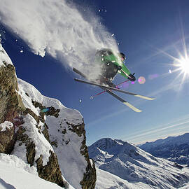 Skier In Midair On Snowy Mountain by Michael Truelove