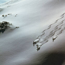 Skier Moving Down In Snow On Slope by John P Kelly