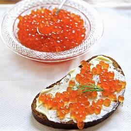 Slice Of Bread-and-butter Topped With Salmon Caviar russia by Andre Baranowski
