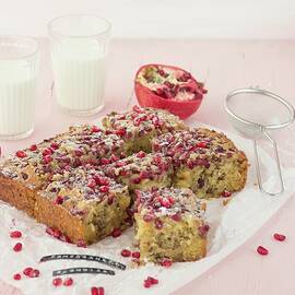 Sliced Blondies With Pomegranate Seeds On A Piece Of Parchment Paper by Emma Friedrichs