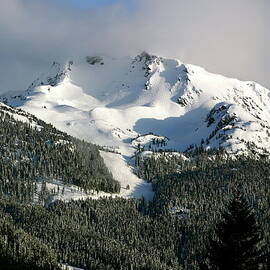 Snow-covered Whistler Mountains Peak by Judy Bishop - The Travelling Eye