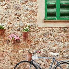 Spain, Balearic Islands, Mallorca, Mediterranean Sea, Illes Balears District, Serra De Tramuntana, Valldemossa, Bicycle In The Village Of Valldemossa by Richard Taylor