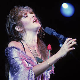 Stevie Nicks Performs On Stage by Hulton Archive