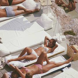 Sunbathers At Eden Roc by Slim Aarons