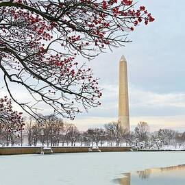 Sunset On A Snowy Washington Monument by John Baggaley
