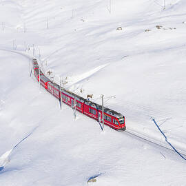 Switzerland, Graubunden, Grisons, Engadin, Alps, The Bernina Express Train At The Bernina Pass by Alessandro Bellani